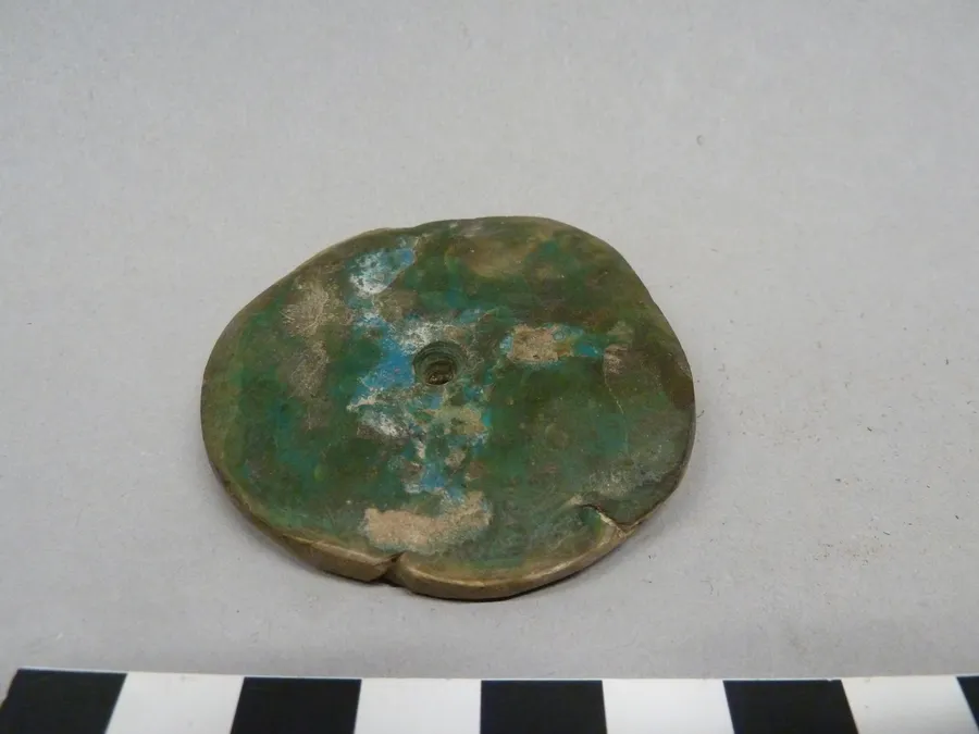 Colgante discoidal