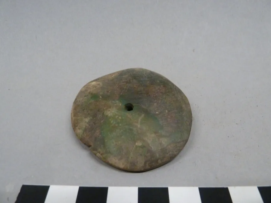 Colgante discoidal