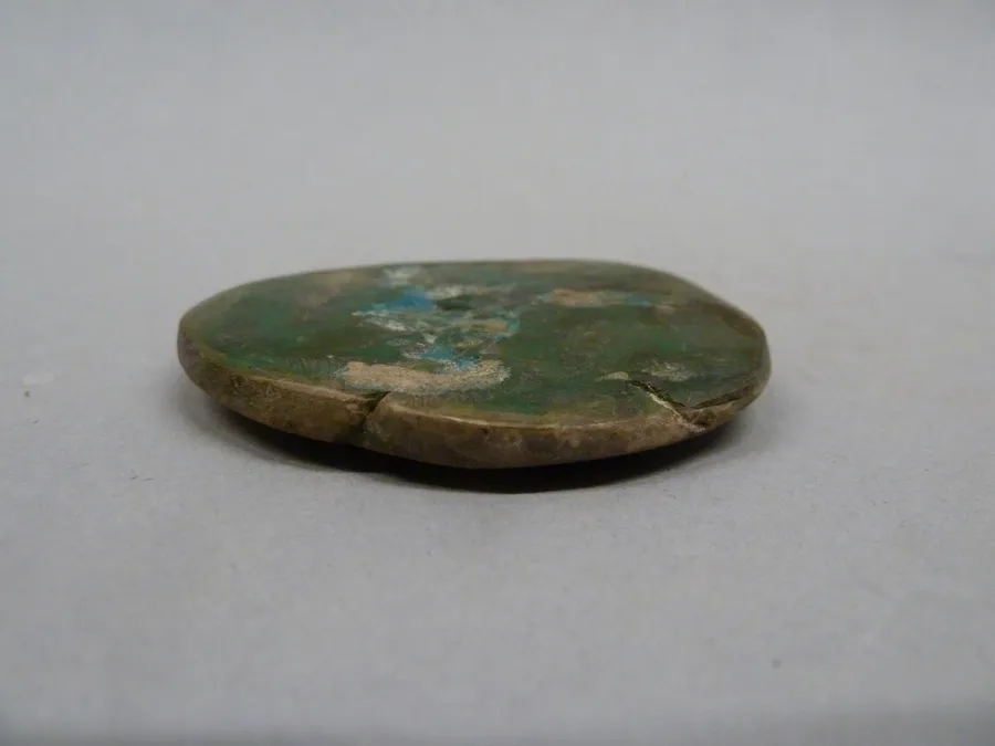 Colgante discoidal